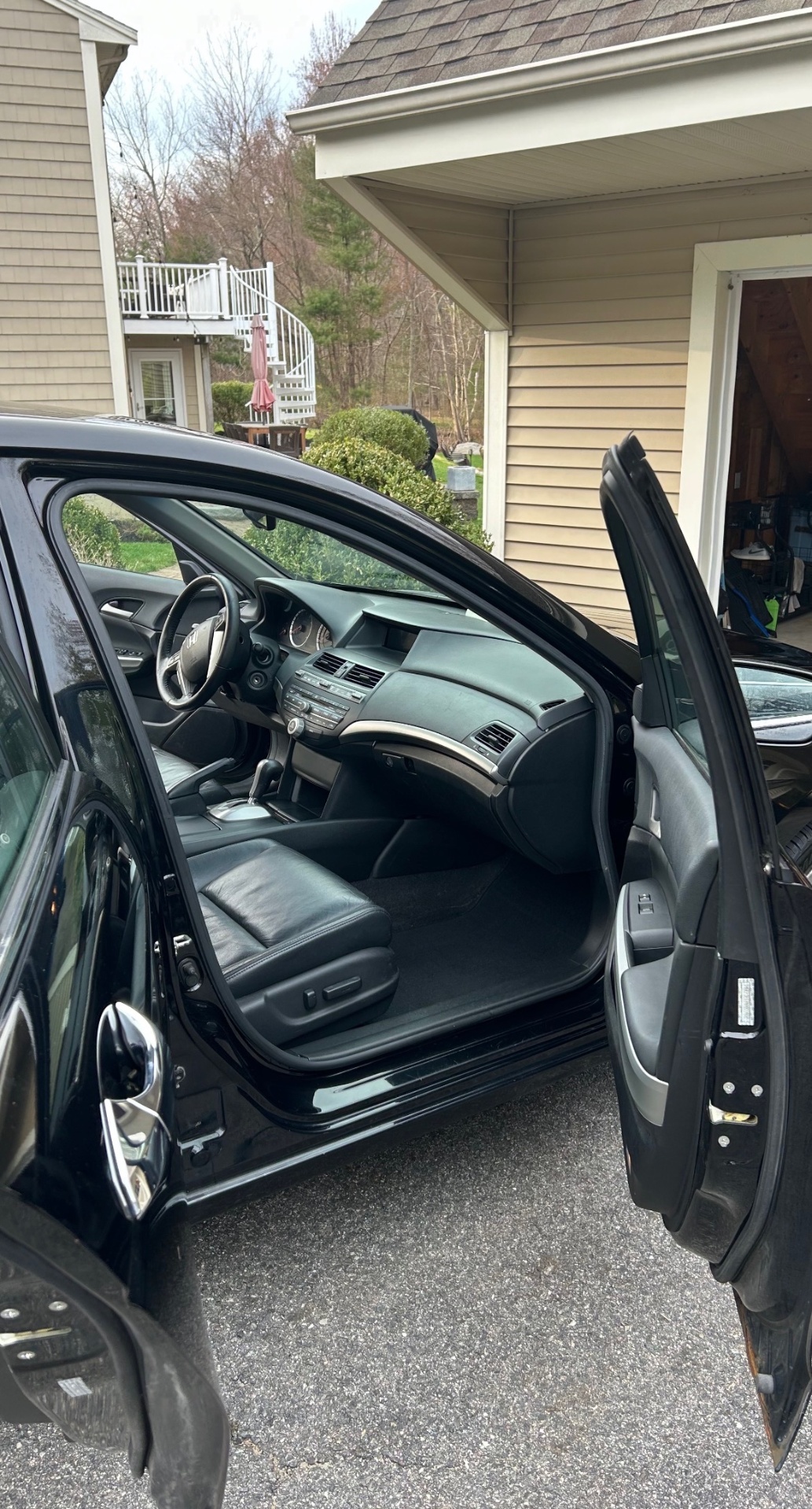 Clean black leather vehicle interior after detailing